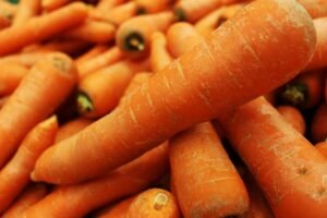 A close-up shot of fresh organic carrots showcasing vibrant orange color and texture.